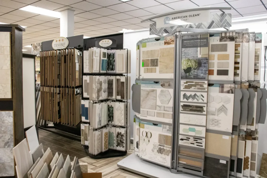 Tile showroom displays featuring various ceramic and mosaic sample boards.