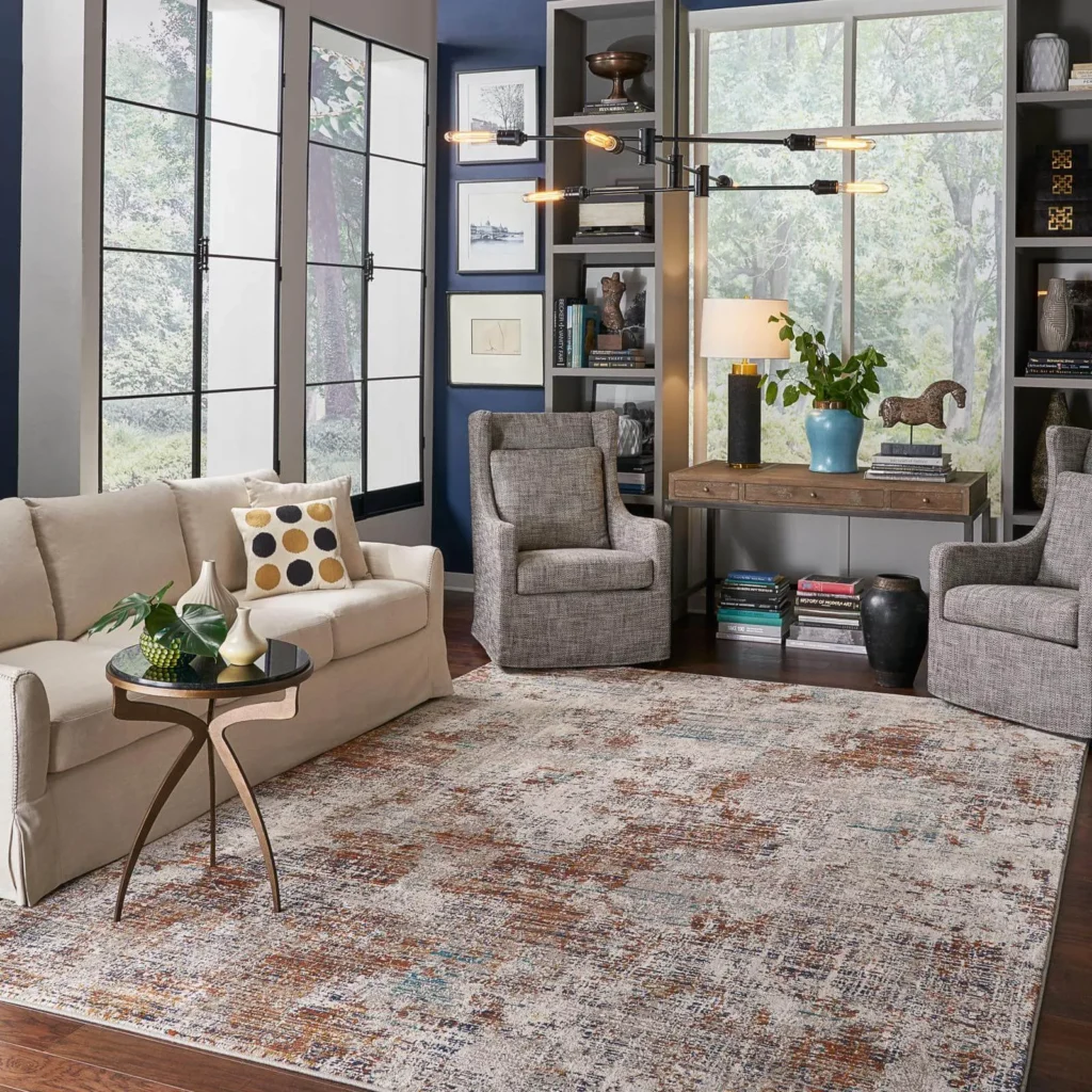 Distressed multicolor abstract area rug in a modern living room.